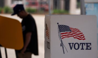 A voter casts ballot during the early voting process at a polling station ahead of the upcoming 2024 presidential election on October 27