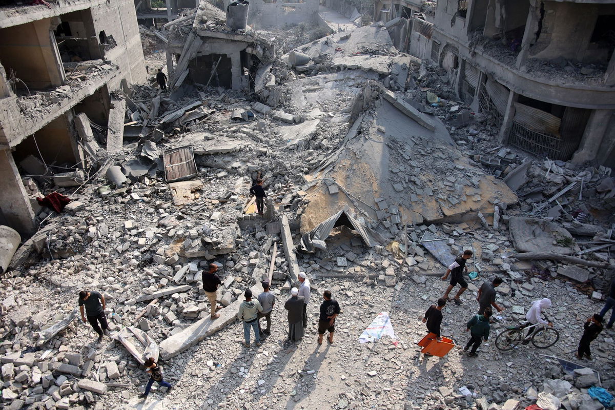 Palestinians check the rubble of the Alloush family's house, leveled in an Israeli strike in Jabaliya in the northern Gaza Strip on November 10.
