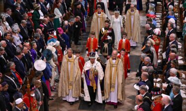 Britain's King Charles III and Queen Camilla depart following their coronation ceremony inside Westminster Abbey in London on May 6