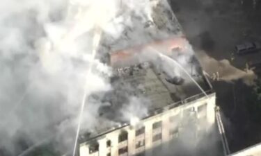 LAFD crews battle a fire that engulfed a historic building in downtown Los Angeles which was once home to the Morrison Hotel