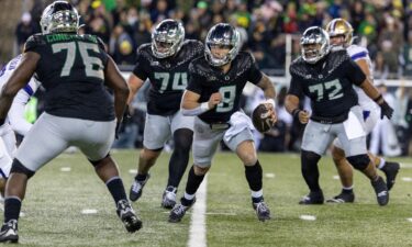 Oregon Ducks quarterback Dillon Gabriel runs against the Washington Huskies.