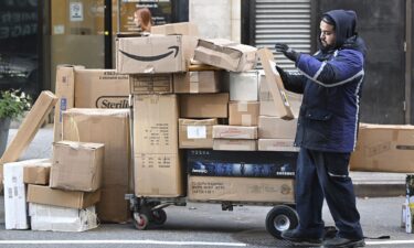 A Fedex worker sorts through packages set for delivery in Manhattan on December 2. Consumers spent a record $13.3 billion on Cyber Monday