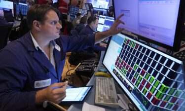 Trader Michael Milano works on the floor of the New York Stock Exchange on Dec. 18