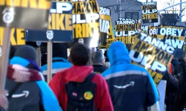 Workers strike outside an Amazon fulfillment center in Queens