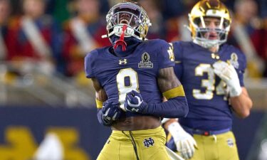 Notre Dame Fighting Irish running back Jeremiyah Love jumps over Indiana Hoosiers defensive back Amare Ferrell.