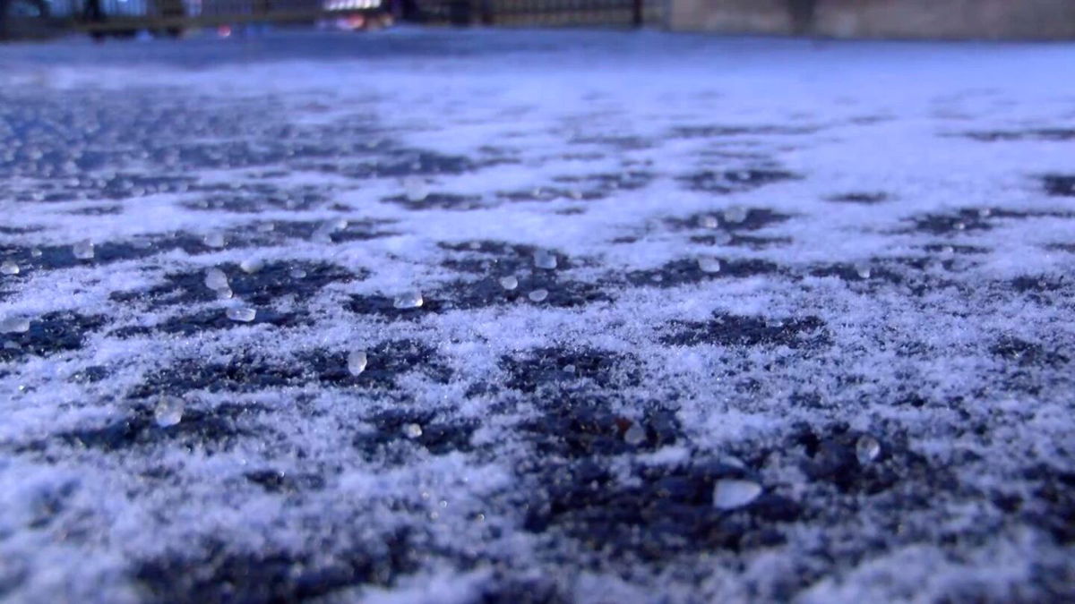 Snow and ice accumulate late afternoon on pavement in Columbia on Saturday, Jan. 4, 2025.