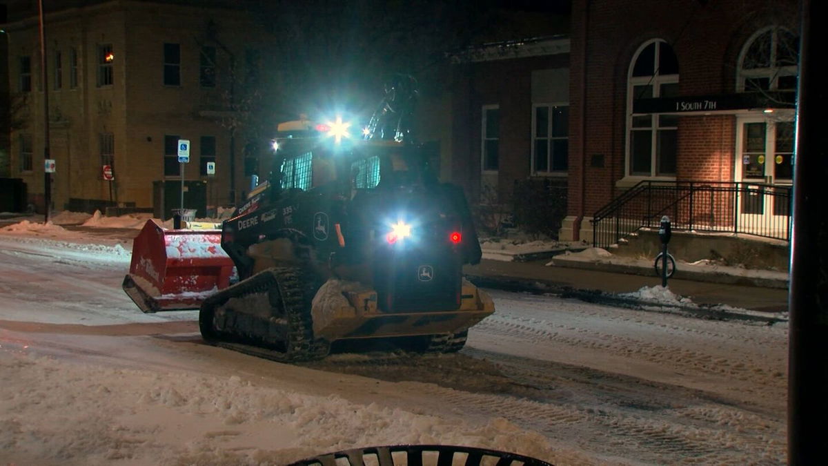 A plow works to clear streets in Downtown Columbia on Tuesday, Jan. 7, 2025.