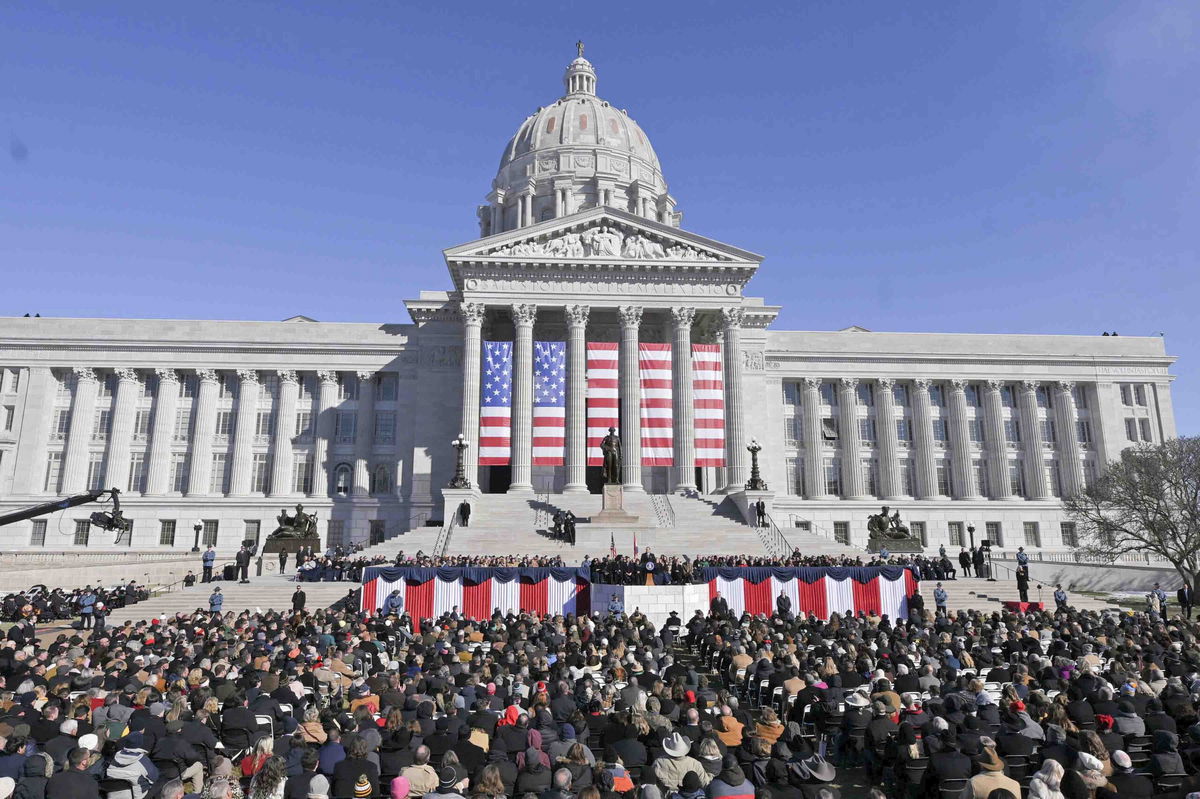 A crowd listens to Gov. Mike Kehoe's inaugural address outside the Missouri Capitol on Monday, Jan. 13, 2025.