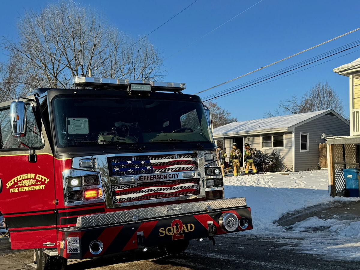 Firefighters work at the scene of a house fire in Jefferson City on Wednesday, Jan. 8, 2025.