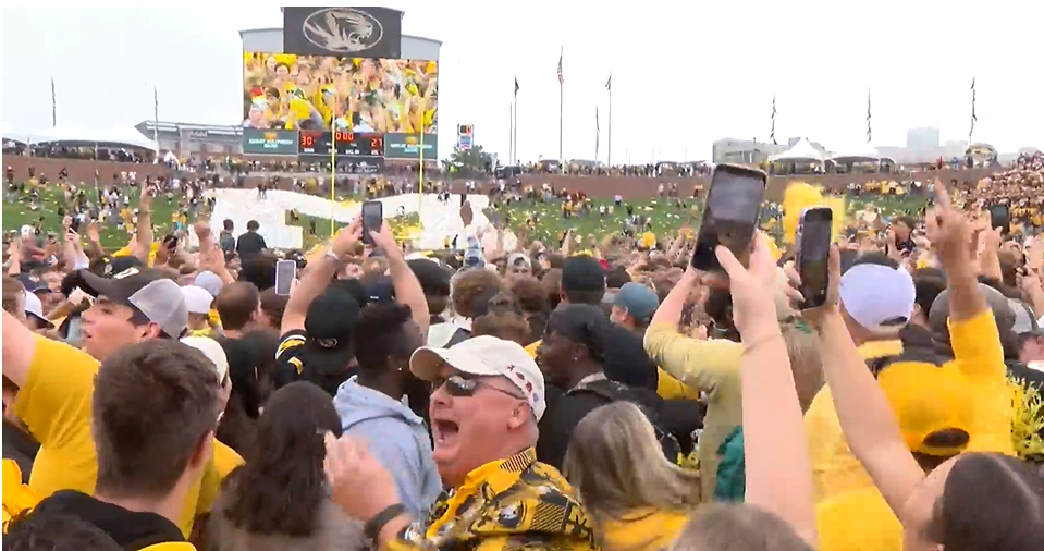 Fans storm Faurot Field after the Missouri Tigers beat the Kansas State Wildcats on Sept. 16, 2023. The football team's success helped grow revenue for the athletics department in the 2023-24 school year.