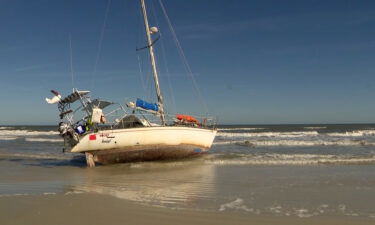 A captain is selling his sailboat for just $1 after it ran aground in New Smyrna Beach