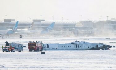 The wreckage of a Delta Air Lines-operated Bombardier CRJ900 aircraft lies upside down February 18 on a runway of Toronto Pearson International Airport.