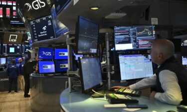 Traders work on the floor of the New York Stock Exchange (NYSE) following the opening bell in New York City on February 24.