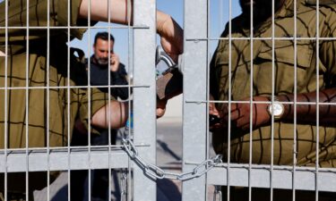 Palestinians inspect the destruction wrought by an Israeli military raid at Al-Shifa Hospital