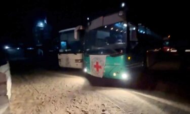 CNN video shows International Committee of the Red Cross buses heading to the Kerem Shalom crossing.