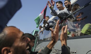 Freed Palestinian prisoners are greeted by a crowd as they arrive in the Gaza following their release on February 1.