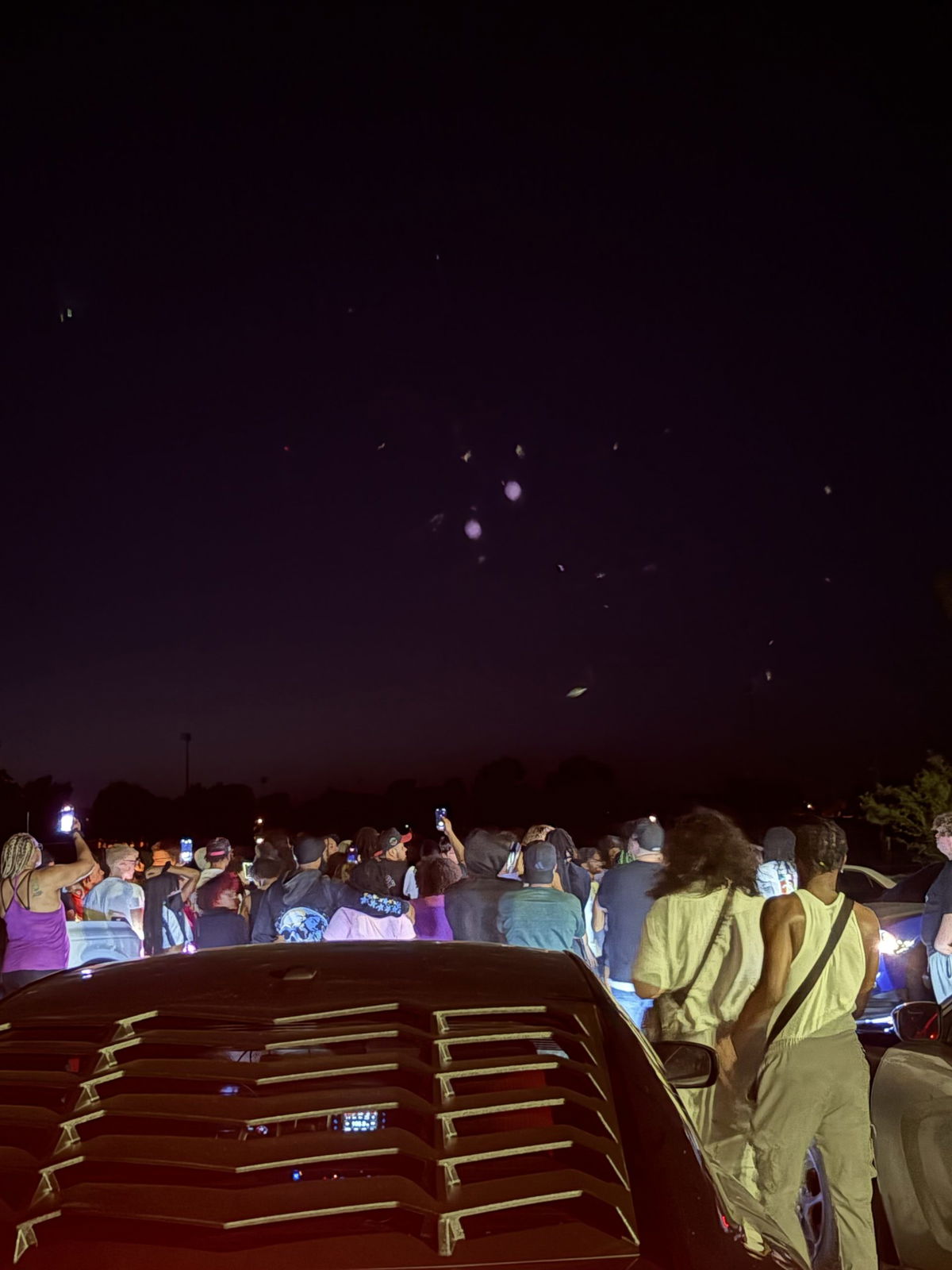 Community members release balloons in honor of slain teen
