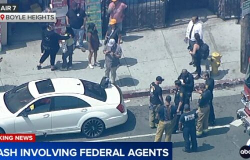 Aerial video from AIR7 showed LAPD officers and Los Angeles Fire Department firefighters at the crash site.