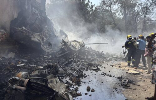Firefighters work at the site of an airplane that crashed in India's northwestern city of Ahmedabad in Gujarat state