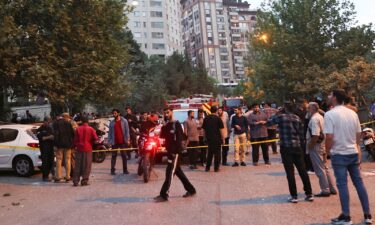 People gather in the street in the aftermath of Israeli strikes