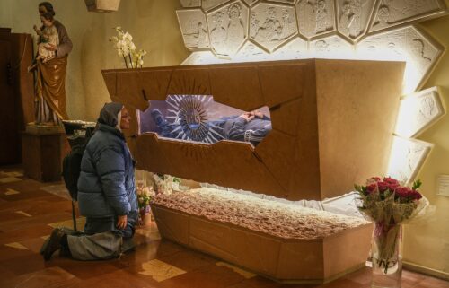 A nun prays at the tomb of Carlo Acutis in the Church of Santa Maria Maggiore in Assisi