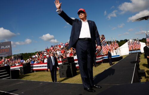 Donald Trump walks offstage after giving remarks at a rally at Greenbrier Farms in June 2024