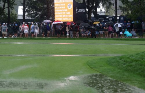 A view of the 18th green as a storm rolls in causing play to be suspended during the final round of the 125th U.S. Open.