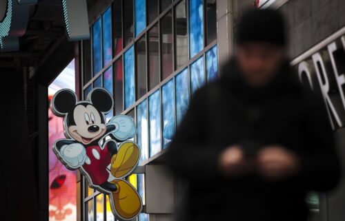 An image of Disney's Mickey Mouse displayed outside the Disney Store in Times Square in December 2017 in New York City. Disney and Universal are suing AI photo generator Midjourney for alleged copyright infringement.