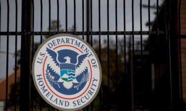 The US Department of Homeland Security (DHS) seal hangs on a fence at the agency's headquarters in Washington